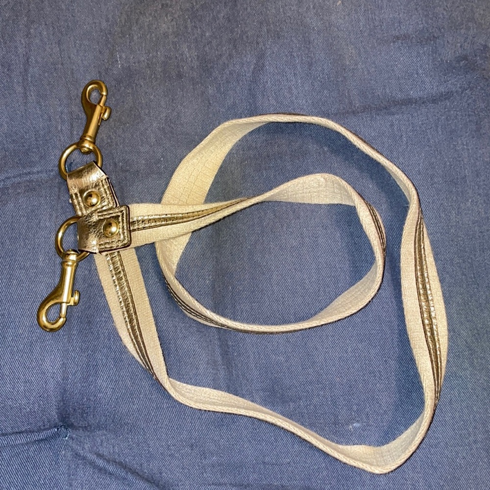 Coach purse strap. Gold stripe and gold colored hooks
